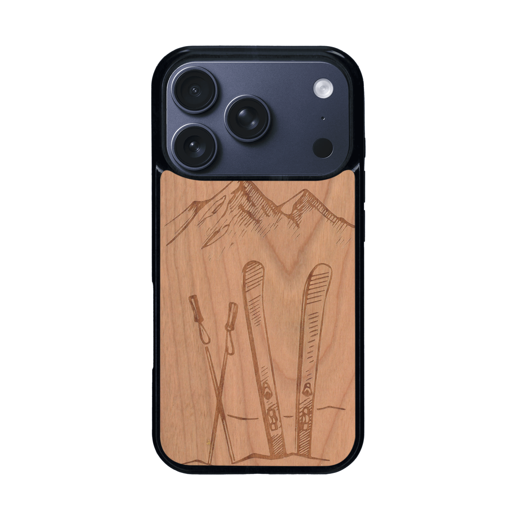 Coque de protection en bois véritable fabriquée en France pour iPhone 17 Pro sur le thème de la montagne, du ski et de la neige avec un motif représentant une paire de ski plantée dans la neige avec en fond des montagnes enneigées