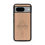 Coque de protection en bois véritable fabriquée en France pour  sur le thème chill avec un motif représentant un couché de soleil sur l'océan et la phrase "Chill out"