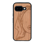 Coque de protection en bois véritable fabriquée en France pour Google Pixel 9A représentant une silhouette féminine épurée de type line art en collaboration avec l'artiste Maud Dabs