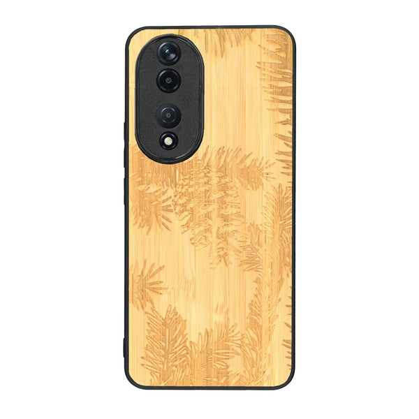 Coque de protection en bois véritable fabriquée en France pour Honor 90 sur le thème de la nature des arbres avec un motif de gravure représentant des épines de sapin et des pommes de pin