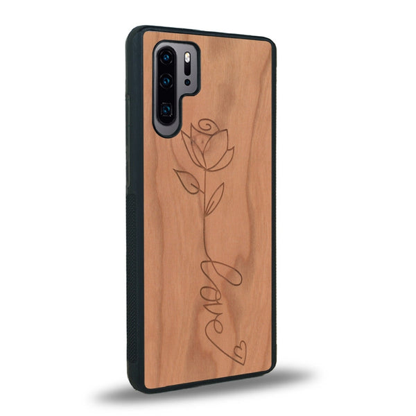 Coque de protection en bois véritable fabriquée en France pour Huawei P30 Pro sur le thème de la fête des mères avec un motif représentant une fleur dont la tige forme le mot "love"