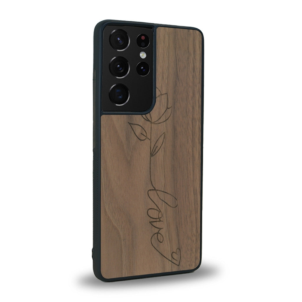 Coque de protection en bois véritable fabriquée en France pour Samsung S21 Ultra sur le thème de la fête des mères avec un motif représentant une fleur dont la tige forme le mot "love"
