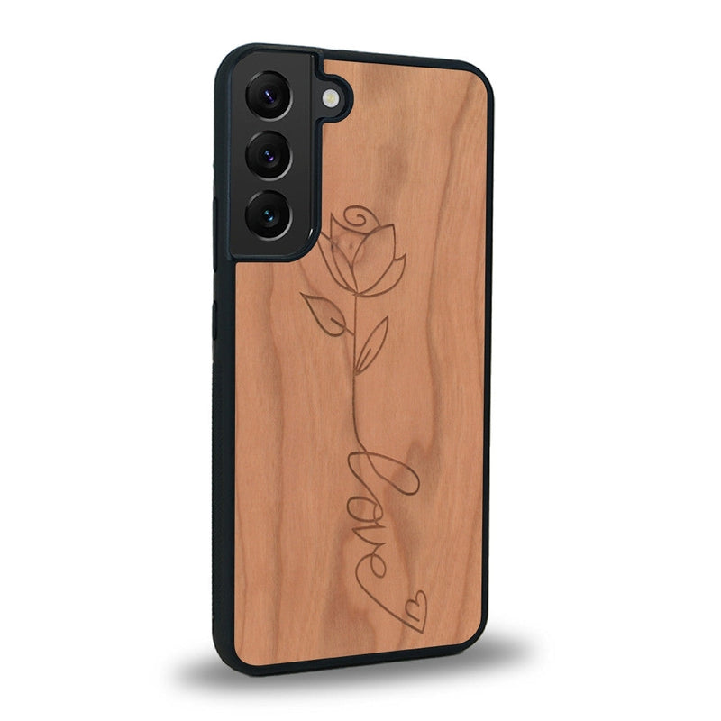 Coque de protection en bois véritable fabriquée en France pour Samsung S23FE sur le thème de la fête des mères avec un motif représentant une fleur dont la tige forme le mot "love"