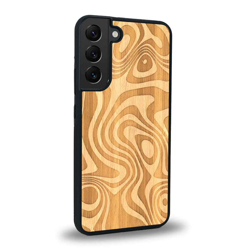 Coque de protection en bois véritable fabriquée en France pour Samsung S24+ avec un motif abstrait représentant les mouvements de l'eau