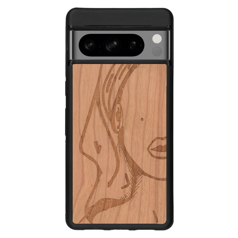 Coque de protection en bois véritable fabriquée en France pour Google Pixel 6a représentant une silhouette féminine épurée de type line art en collaboration avec l'artiste Maud Dabs