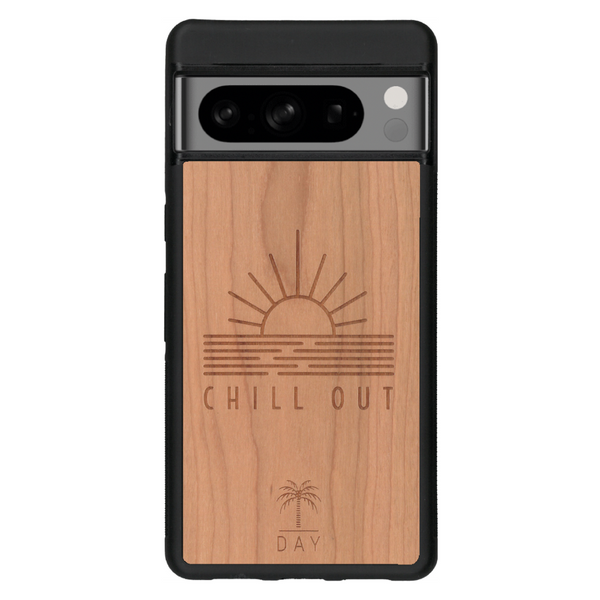 Coque de protection en bois véritable fabriquée en France pour Google Pixel 6a sur le thème chill avec un motif représentant un couché de soleil sur l'océan et la phrase "Chill out"