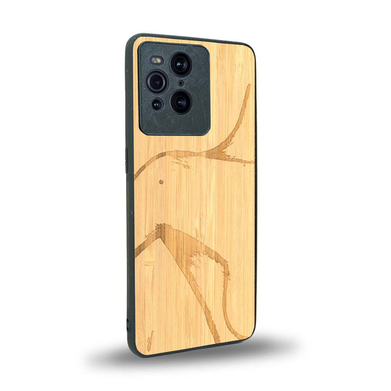 Coque de protection en bois véritable fabriquée en France pour Oppo Find X3 Pro représentant une silhouette féminine dessinée à la main par l'artiste Maud Dabs