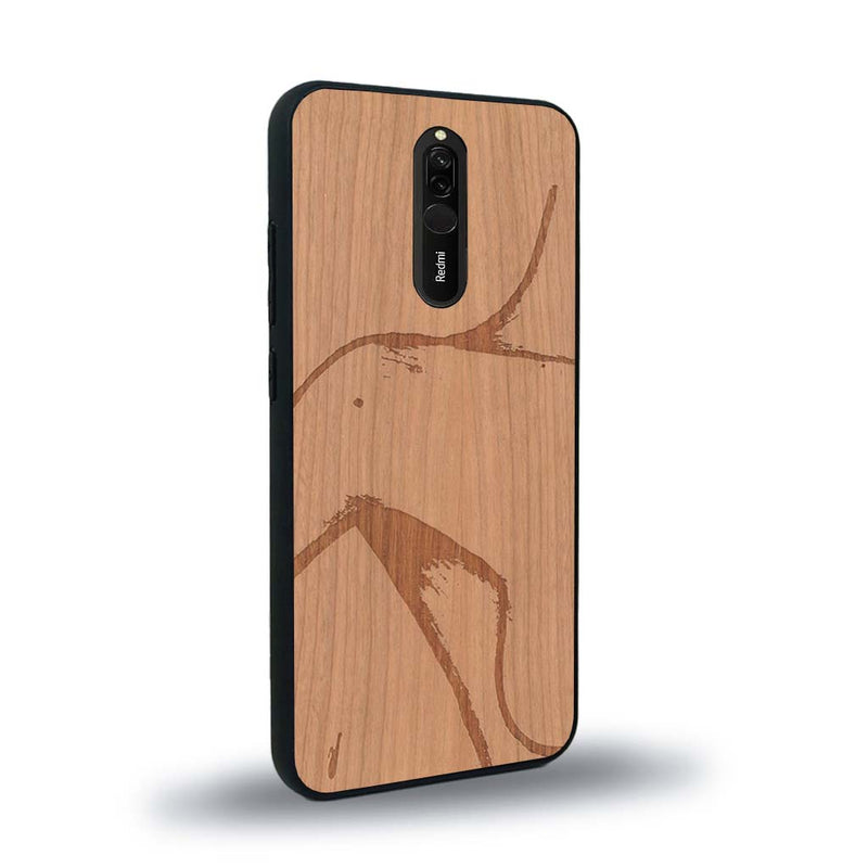 Coque de protection en bois véritable fabriquée en France pour Xiaomi Mi 9T représentant une silhouette féminine dessinée à la main par l'artiste Maud Dabs