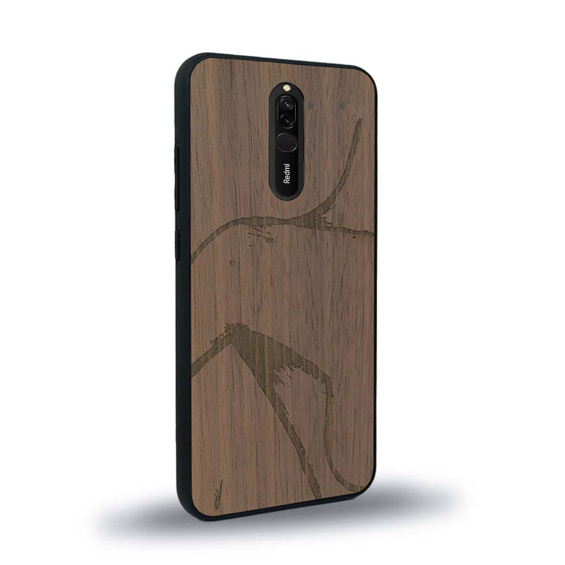 Coque de protection en bois véritable fabriquée en France pour Xiaomi Mi 9T représentant une silhouette féminine dessinée à la main par l'artiste Maud Dabs