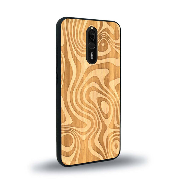 Coque de protection en bois véritable fabriquée en France pour Xiaomi Mi 9T avec un motif abstrait représentant les mouvements de l'eau