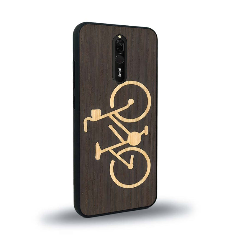 Coque de protection en bois véritable fabriquée en France pour Xiaomi Mi 9T sur le theme du vélo et de l'outdoor qui allie du bambou et du chêne fumé représentant un vélo